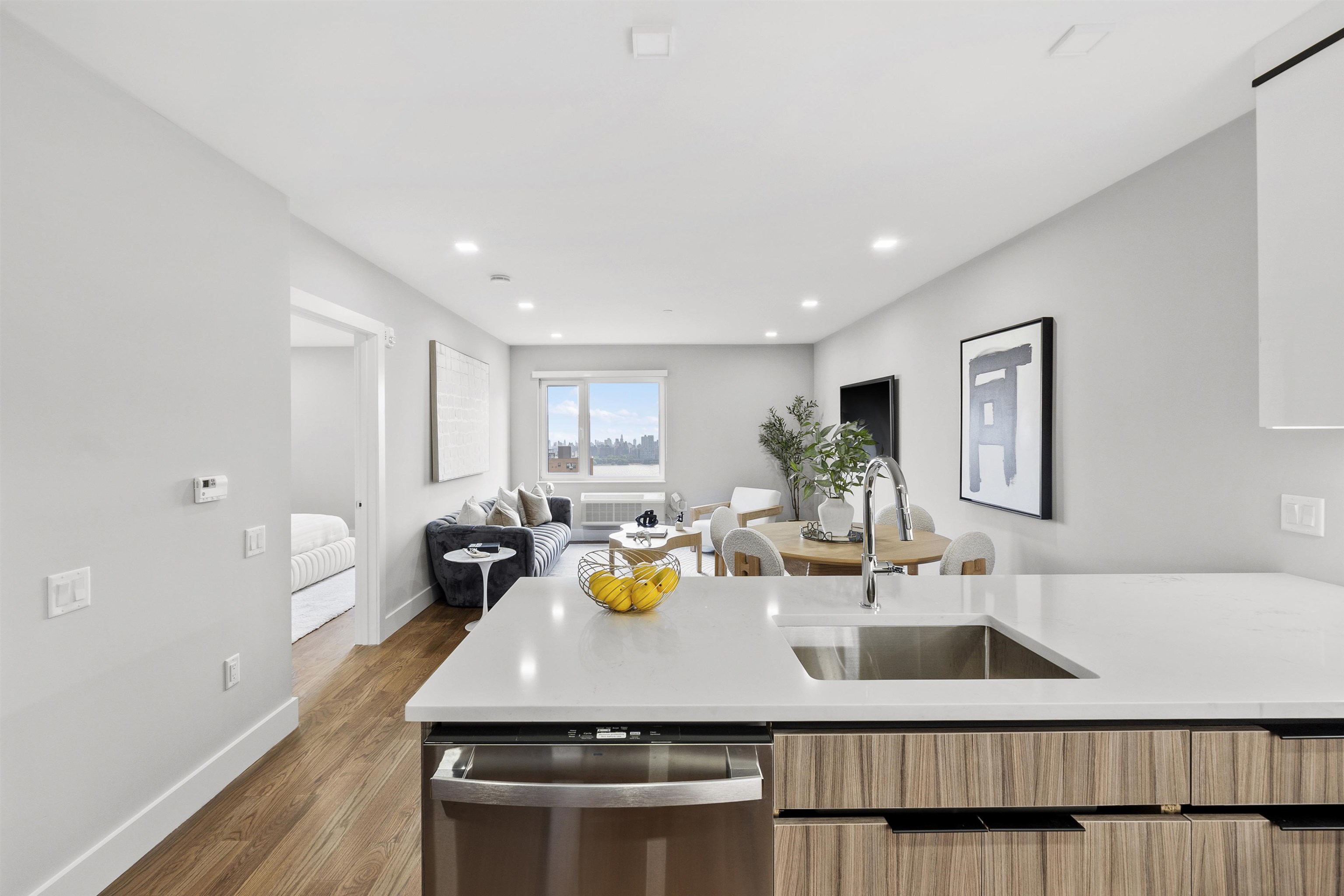 60-64 68th Street, Unit 208 Guttenberg, NJ 07093 - Photo 21 of 29 a view of a dining room with furniture and wooden floor