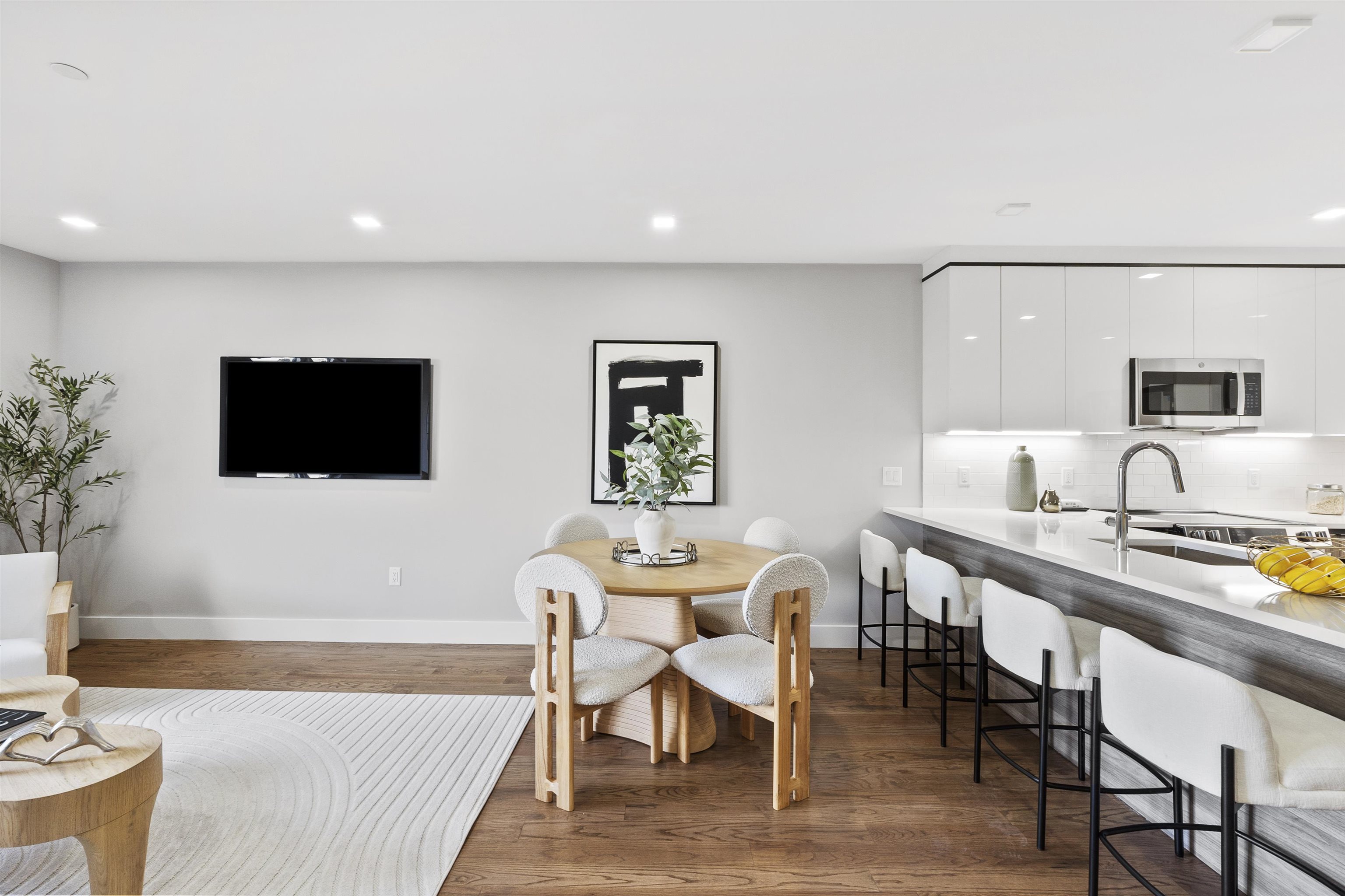 60-64 68th Street, Unit 208 Guttenberg, NJ 07093 - Photo 8 of 29 a view of a dining room with furniture