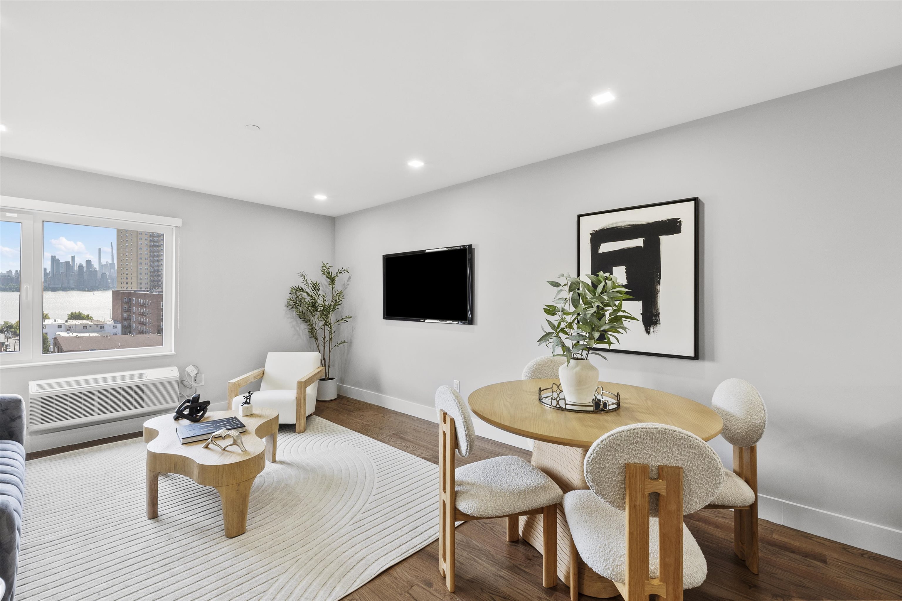 60-64 68th Street, Unit 208 Guttenberg, NJ 07093 - Photo 9 of 29 a dining room with a table and chairs