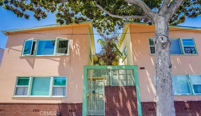 front view of a house with a tree