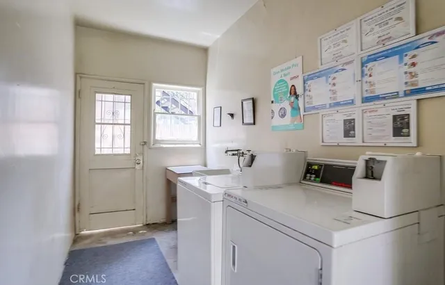 a kitchen that has a sink and a stove in it
