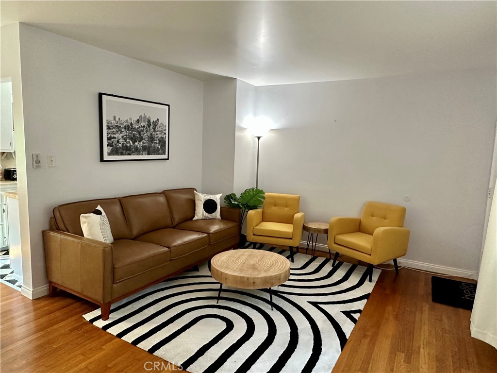 219 Esperanza Avenue, Unit 7 Long Beach, CA 90802 - Photo 5 of 13 a living room with furniture and wooden floor