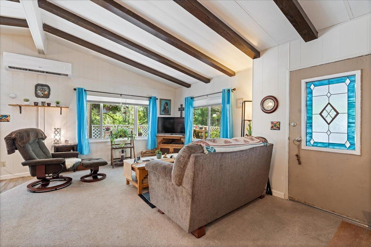 4420 Pleasant Valley Road, Unit 131 Diamond Springs, CA 95619 - Photo 12 of 30 a living room with furniture and a large window