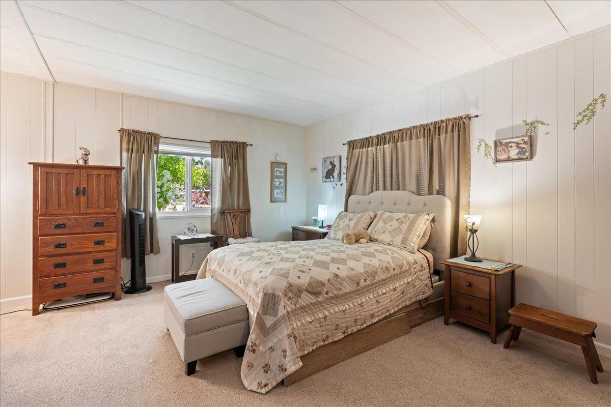 4420 Pleasant Valley Road, Unit 131 Diamond Springs, CA 95619 - Photo 15 of 30 a bedroom with a bed and furniture