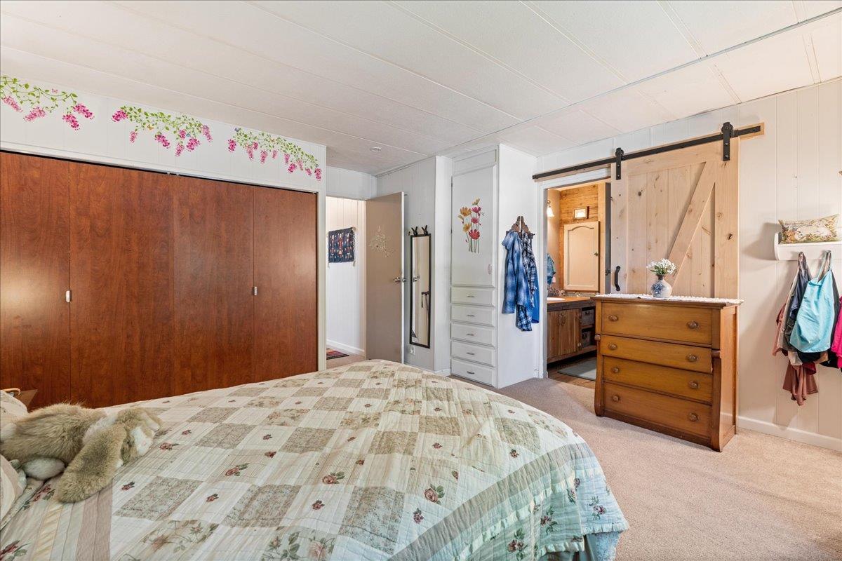 4420 Pleasant Valley Road, Unit 131 Diamond Springs, CA 95619 - Photo 16 of 30 a bedroom with a bed and a window