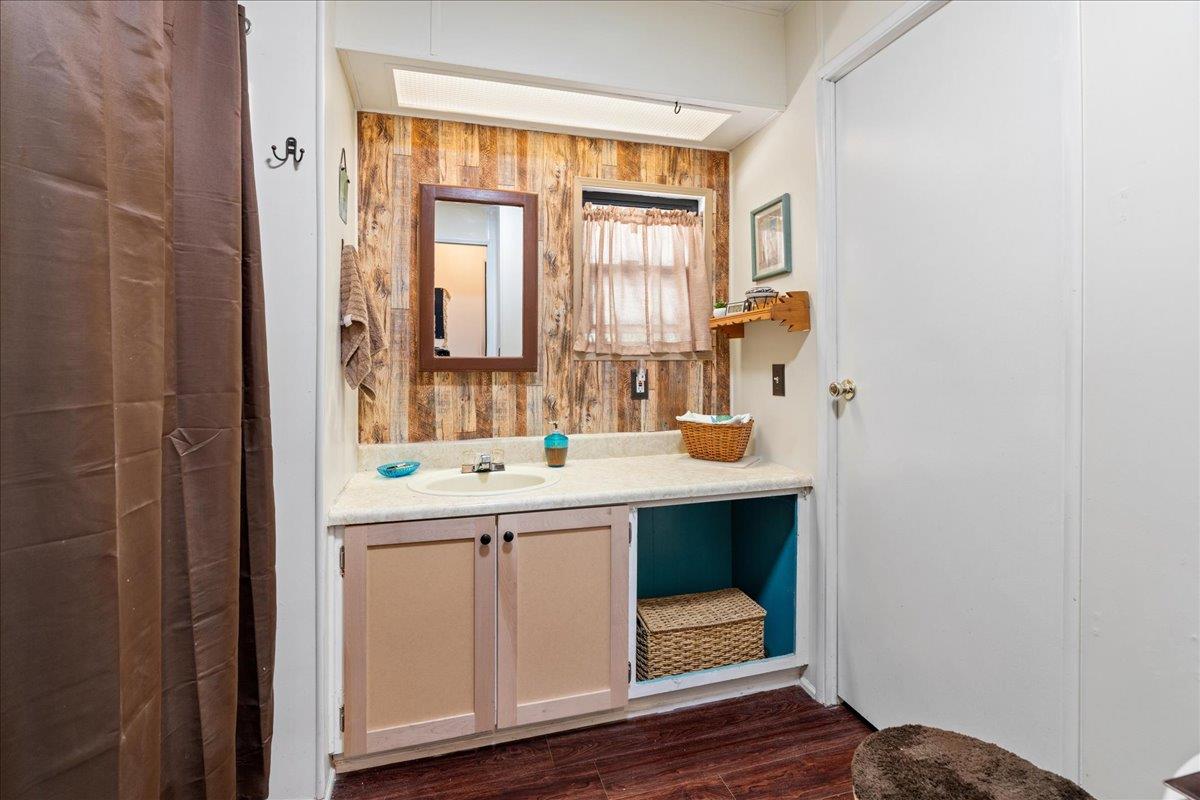4420 Pleasant Valley Road, Unit 131 Diamond Springs, CA 95619 - Photo 18 of 30 a bathroom with a sink and a mirror