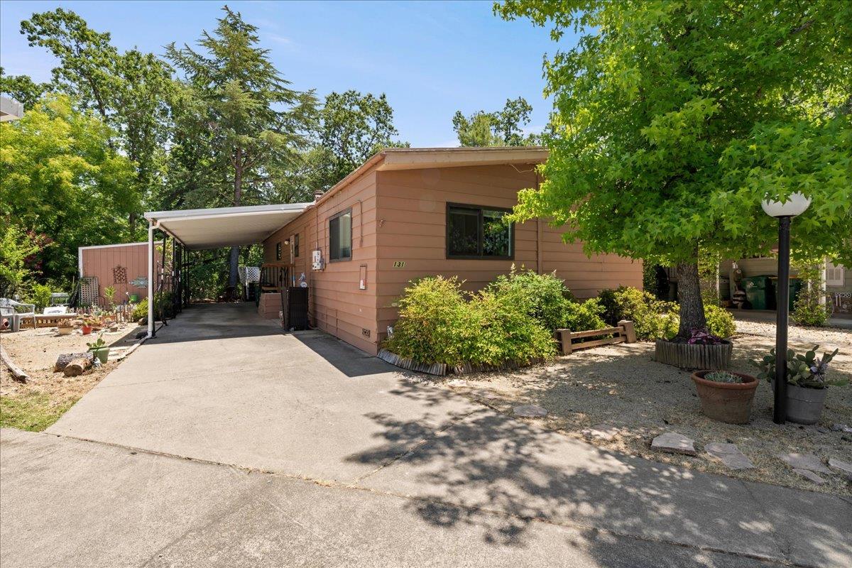 4420 Pleasant Valley Road, Unit 131 Diamond Springs, CA 95619 - Photo 28 of 30 a view of a backyard with sitting area and furniture