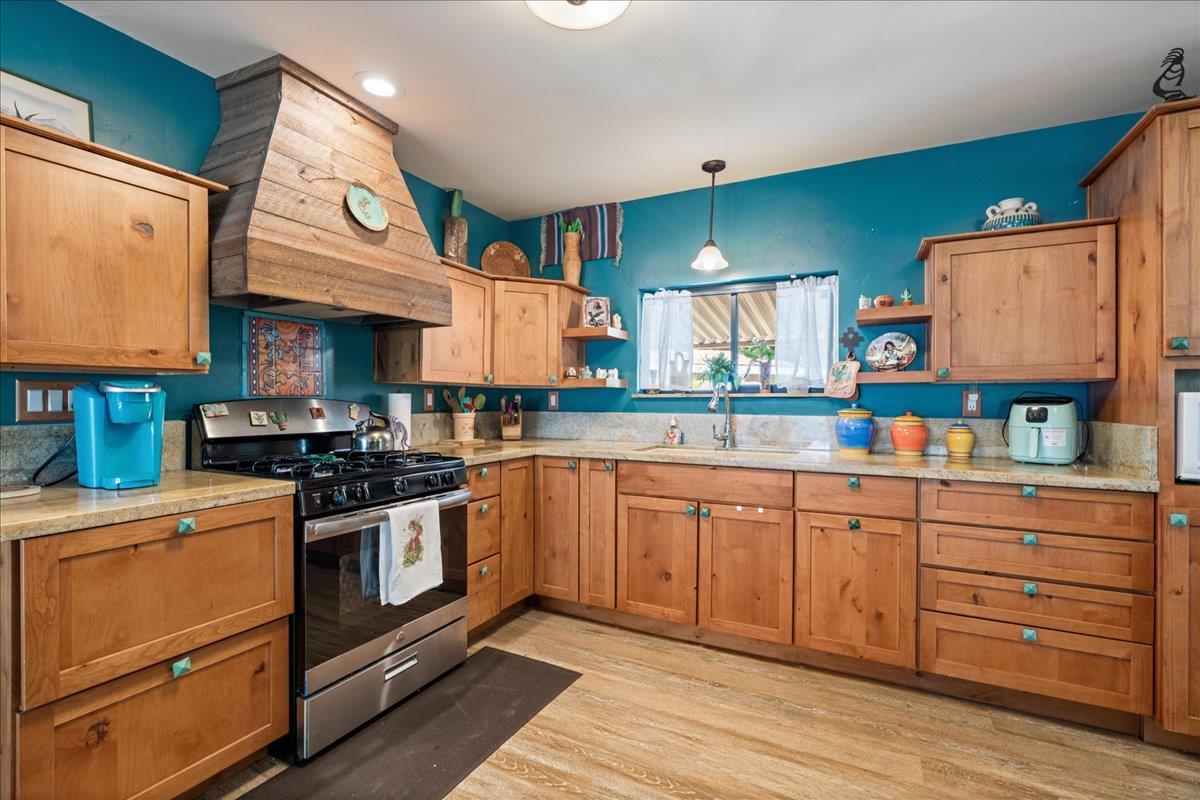 4420 Pleasant Valley Road, Unit 131 Diamond Springs, CA 95619 - Photo 3 of 30 a kitchen with stainless steel appliances granite countertop a stove and cabinets