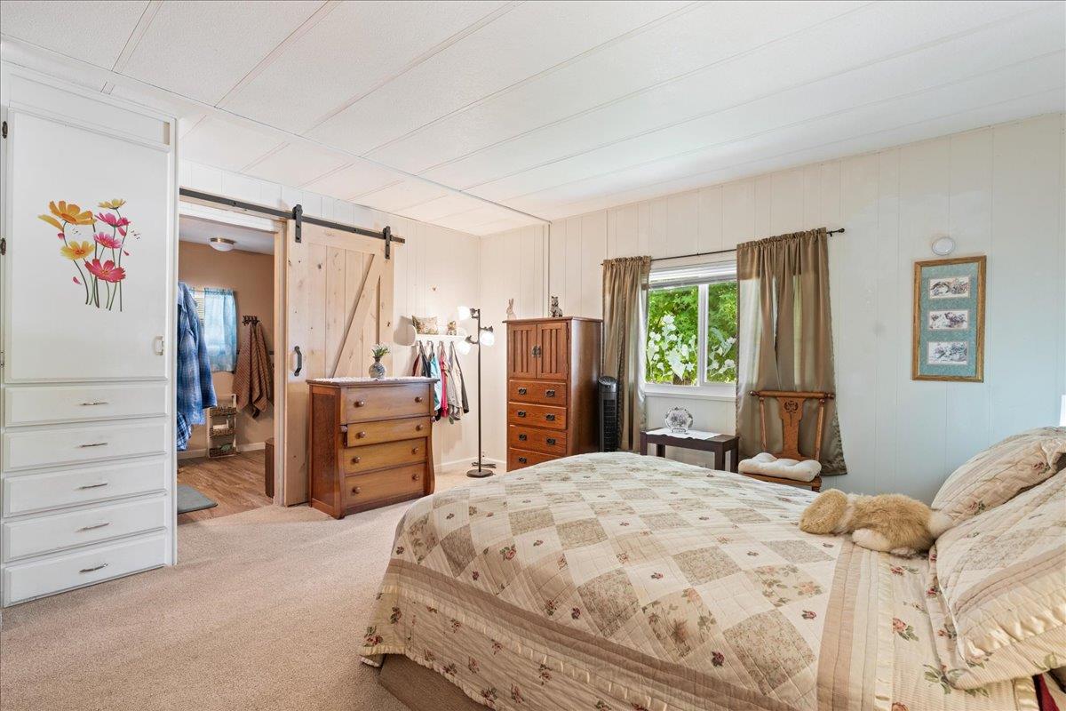 4420 Pleasant Valley Road, Unit 131 Diamond Springs, CA 95619 - Photo 7 of 30 a bedroom with a bed and a window