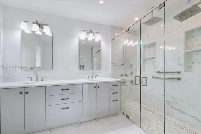 a bathroom with a double vanity sink mirror and double