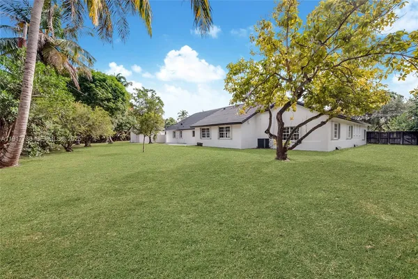 a house view with garden space