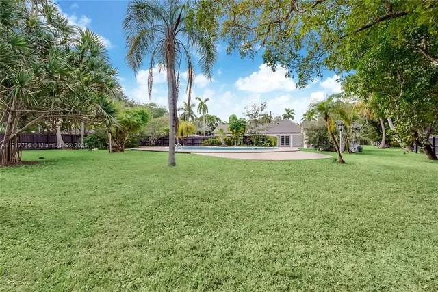 a house with palm tree in the background