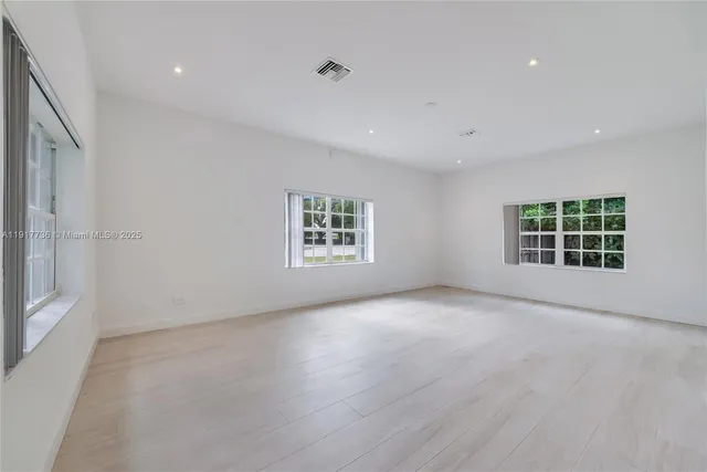 an empty room with windows