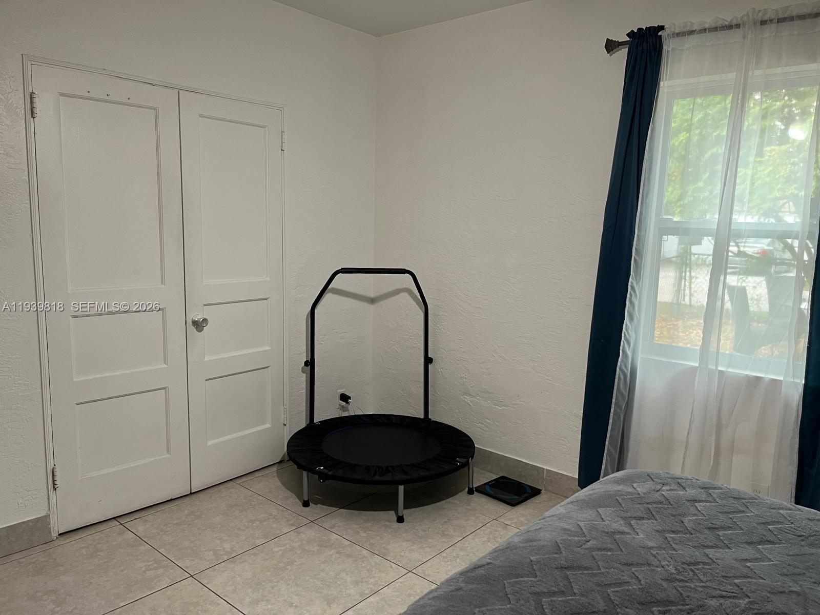 2116 Monroe Terrace Hollywood, FL 33020 - Photo 29 of 40 a living room with a sink and a mirror