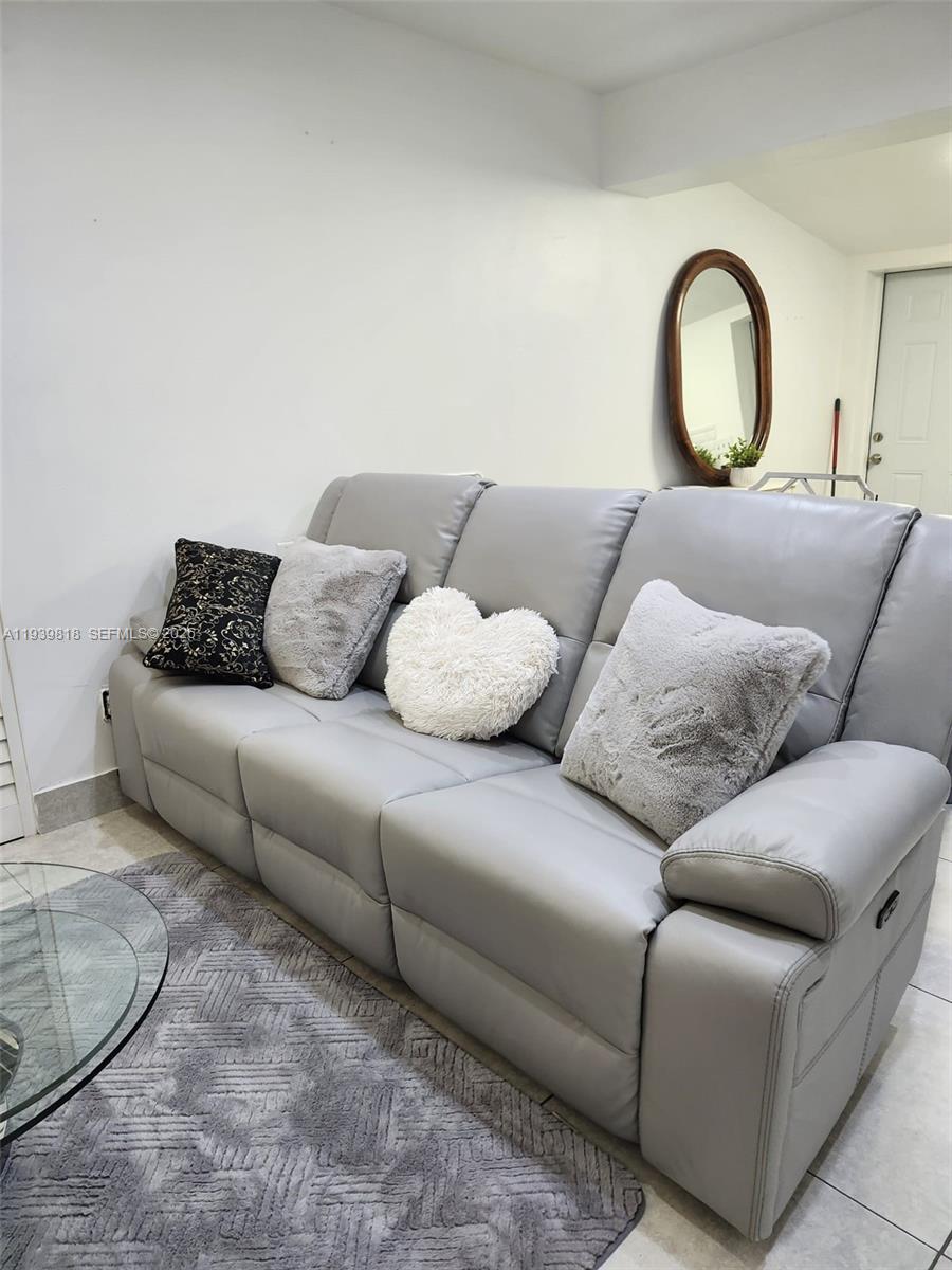 2116 Monroe Terrace Hollywood, FL 33020 - Photo 35 of 40 a living room with furniture and a large window