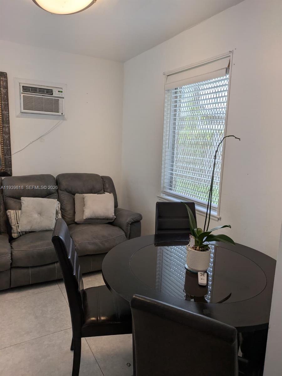 2116 Monroe Terrace Hollywood, FL 33020 - Photo 8 of 40 a living room with furniture and a potted plant