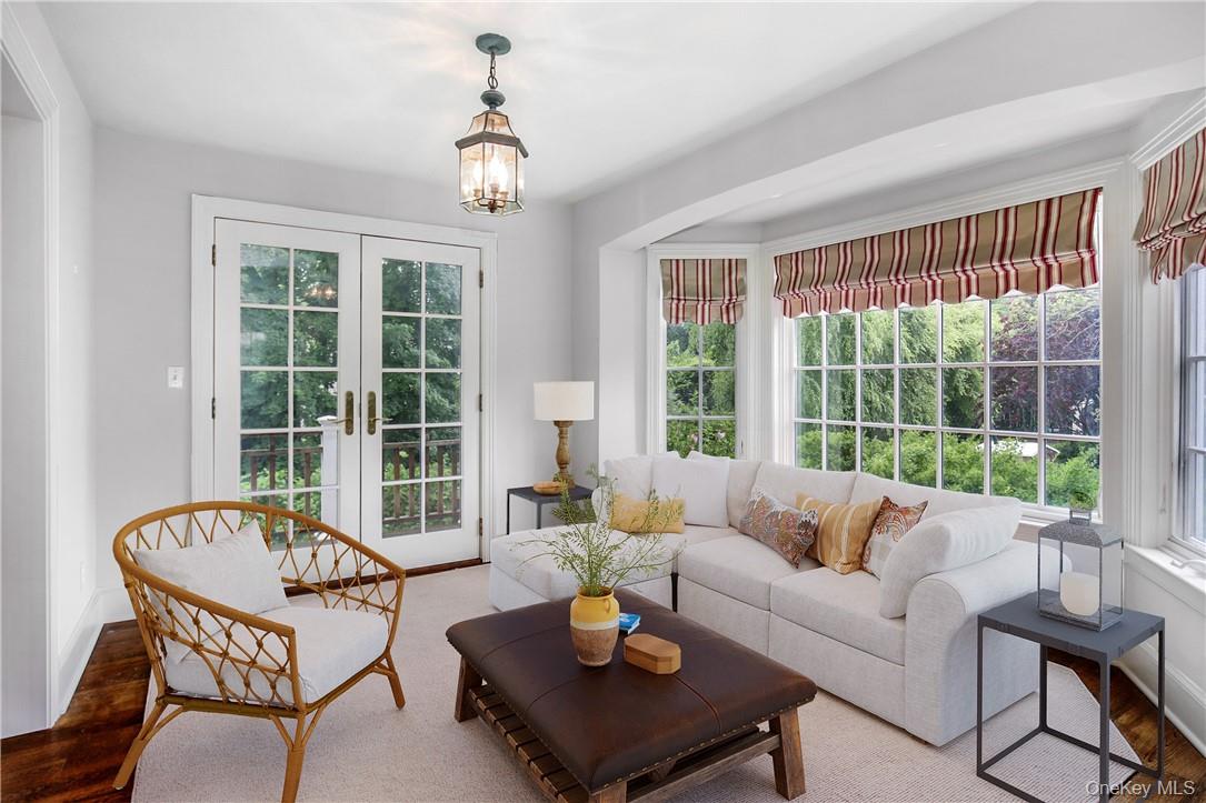 96 Mendota Avenue Rye, NY 10580 - Photo 4 of 18 Virtually staged -- inviting Sunroom with door out to backyard