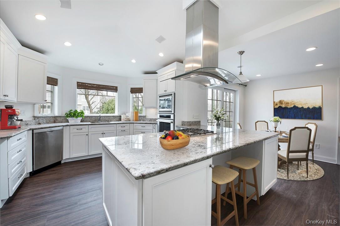 96 Mendota Avenue Rye, NY 10580 - Photo 6 of 18 Virtually staged--kitchen with breakfast area and doors to backyard