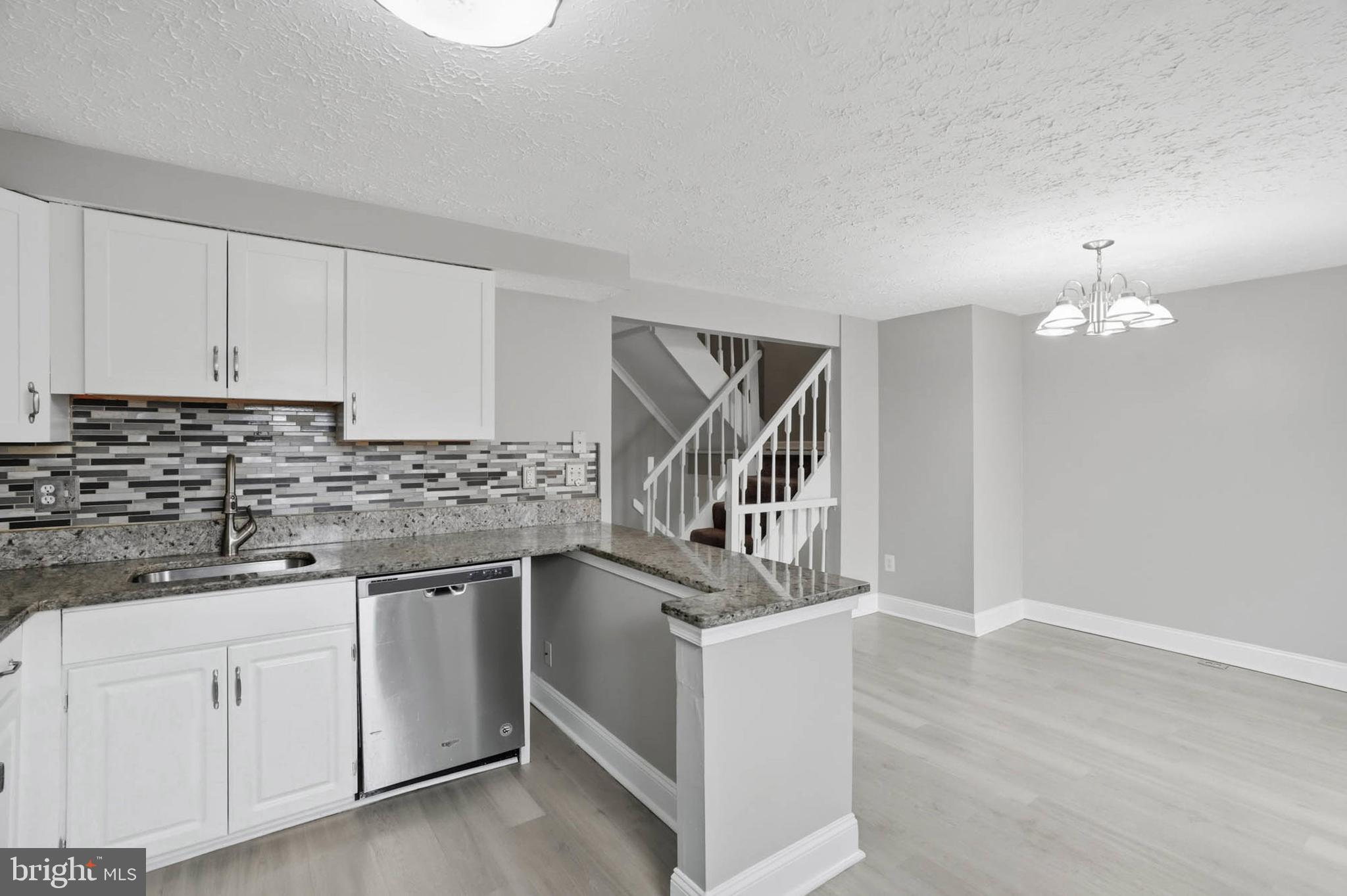 9931 Tuscarora Road Randallstown, MD 21133 - Photo 13 of 30 a kitchen that has a sink and cabinets