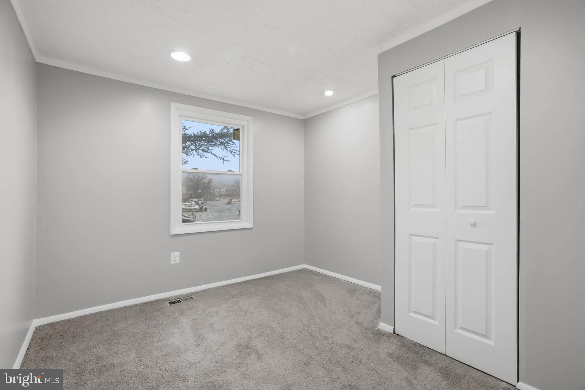 9931 Tuscarora Road Randallstown, MD 21133 - Photo 14 of 30 an empty room with windows