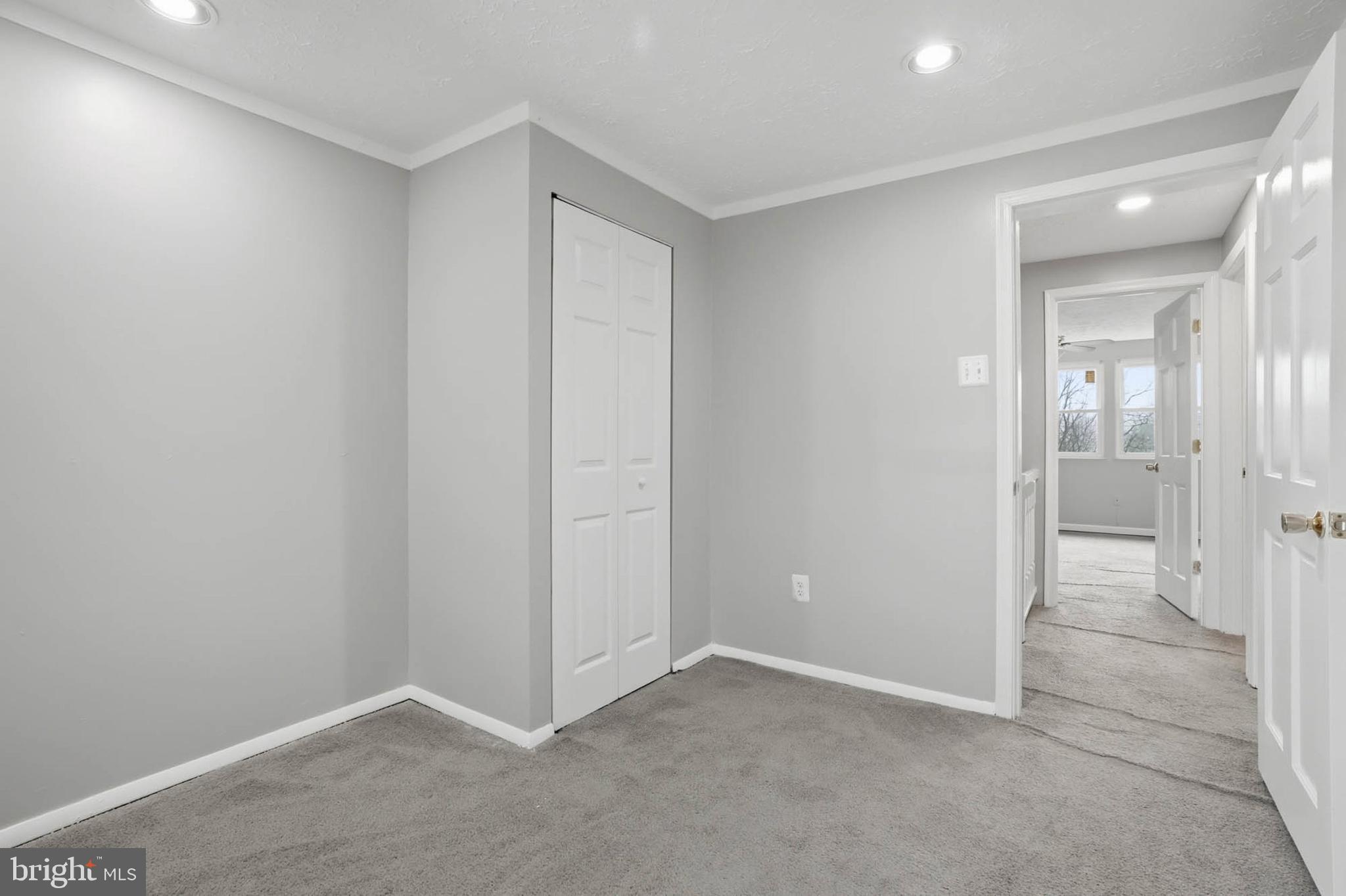 9931 Tuscarora Road Randallstown, MD 21133 - Photo 15 of 30 an empty room with an entrance to other room