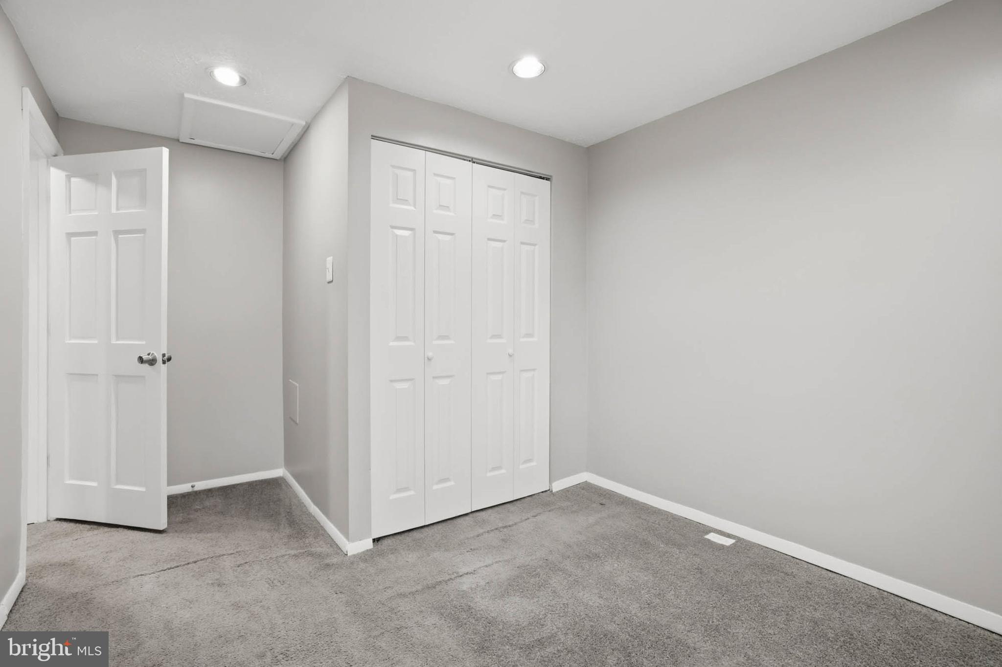 9931 Tuscarora Road Randallstown, MD 21133 - Photo 17 of 30 an empty room with windows