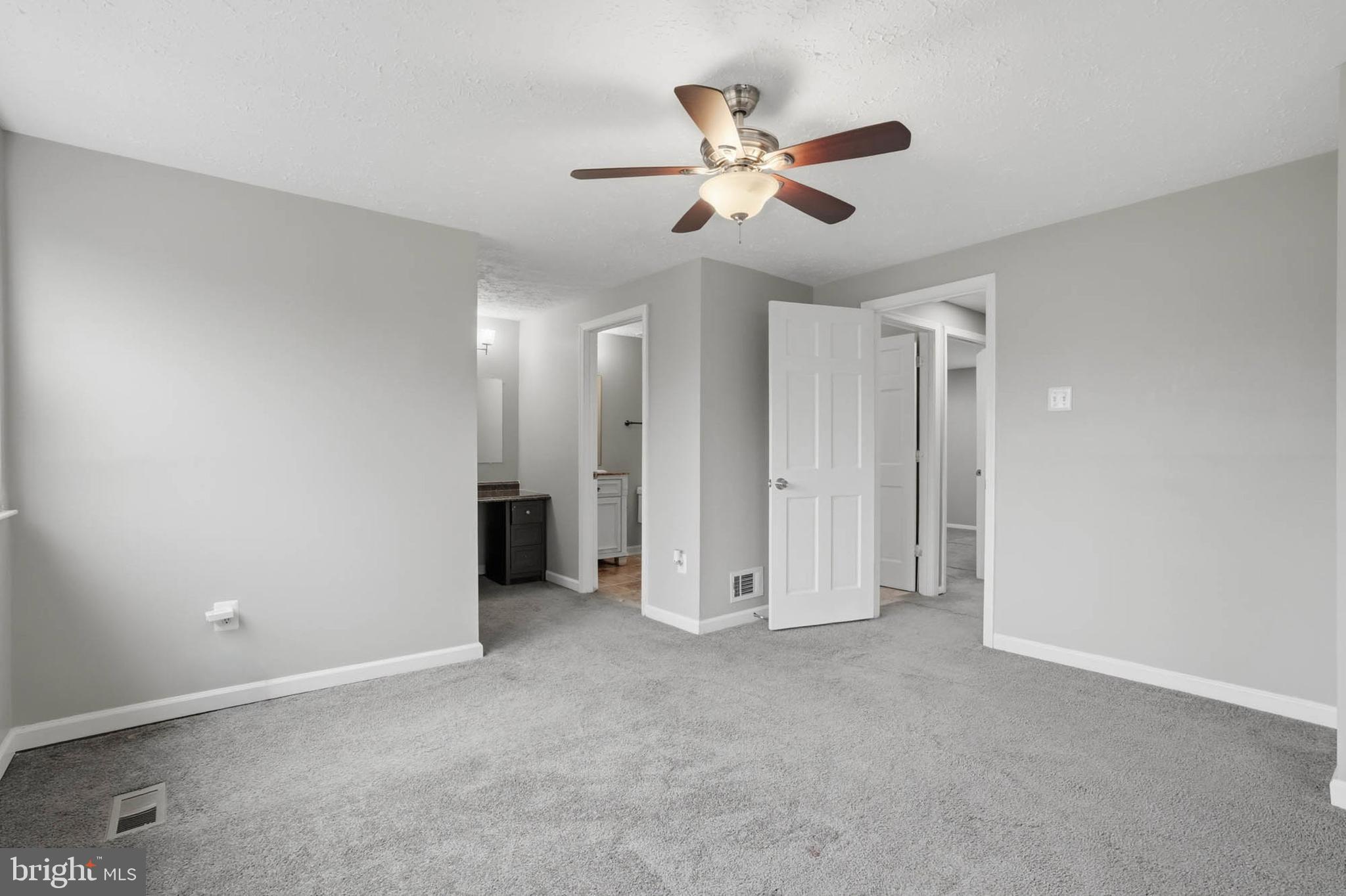 9931 Tuscarora Road Randallstown, MD 21133 - Photo 19 of 30 a view of an empty room and chandelier fan
