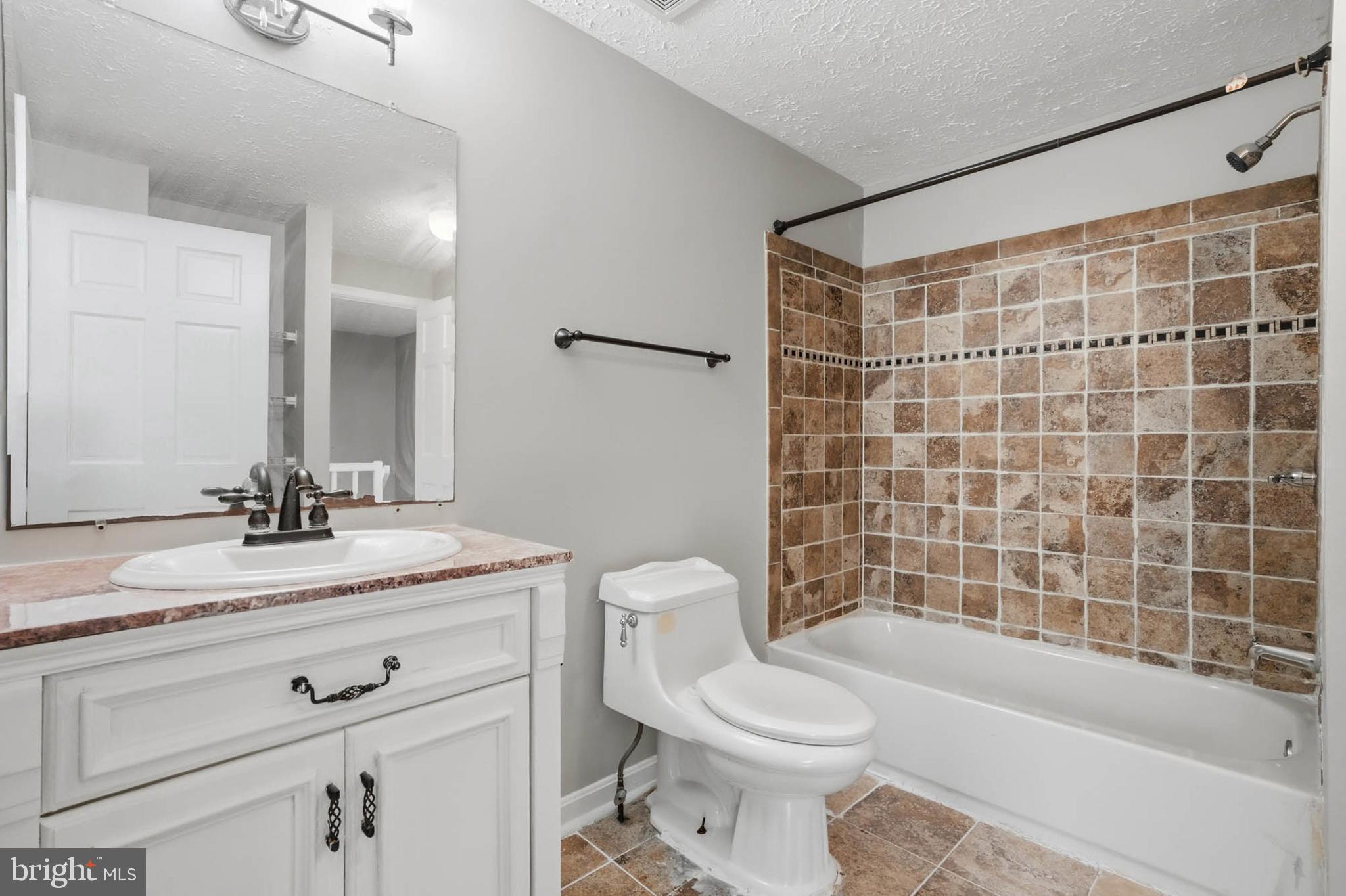 9931 Tuscarora Road Randallstown, MD 21133 - Photo 21 of 30 a bathroom with a sink a toilet and shower