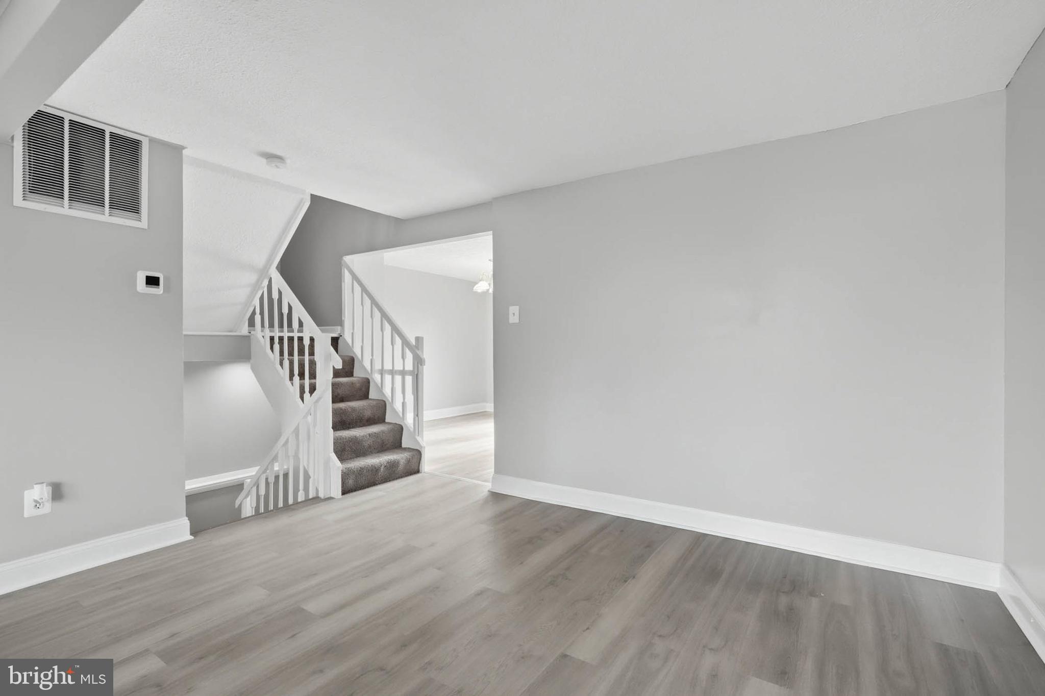9931 Tuscarora Road Randallstown, MD 21133 - Photo 6 of 30 a view of entryway and hall with wooden floor