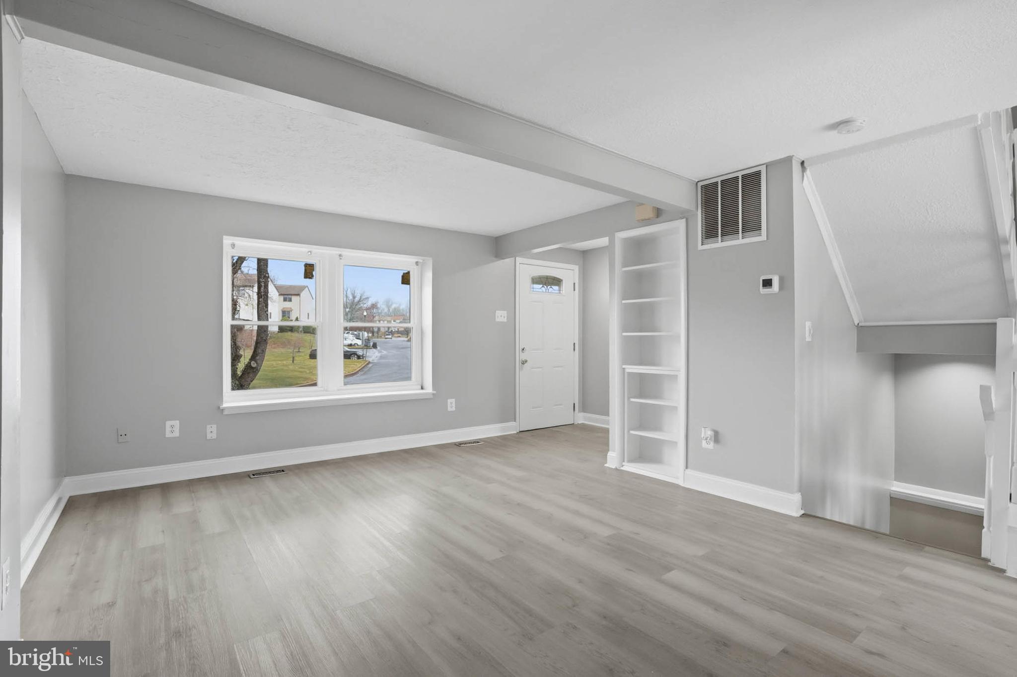 9931 Tuscarora Road Randallstown, MD 21133 - Photo 7 of 30 an empty room with wooden floor and window
