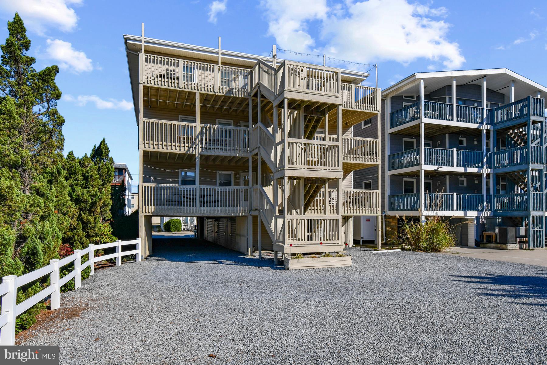 13 75th Street, Unit 1W Ocean City, MD 21842 - Photo 21 of 26 a view of a house with a yard