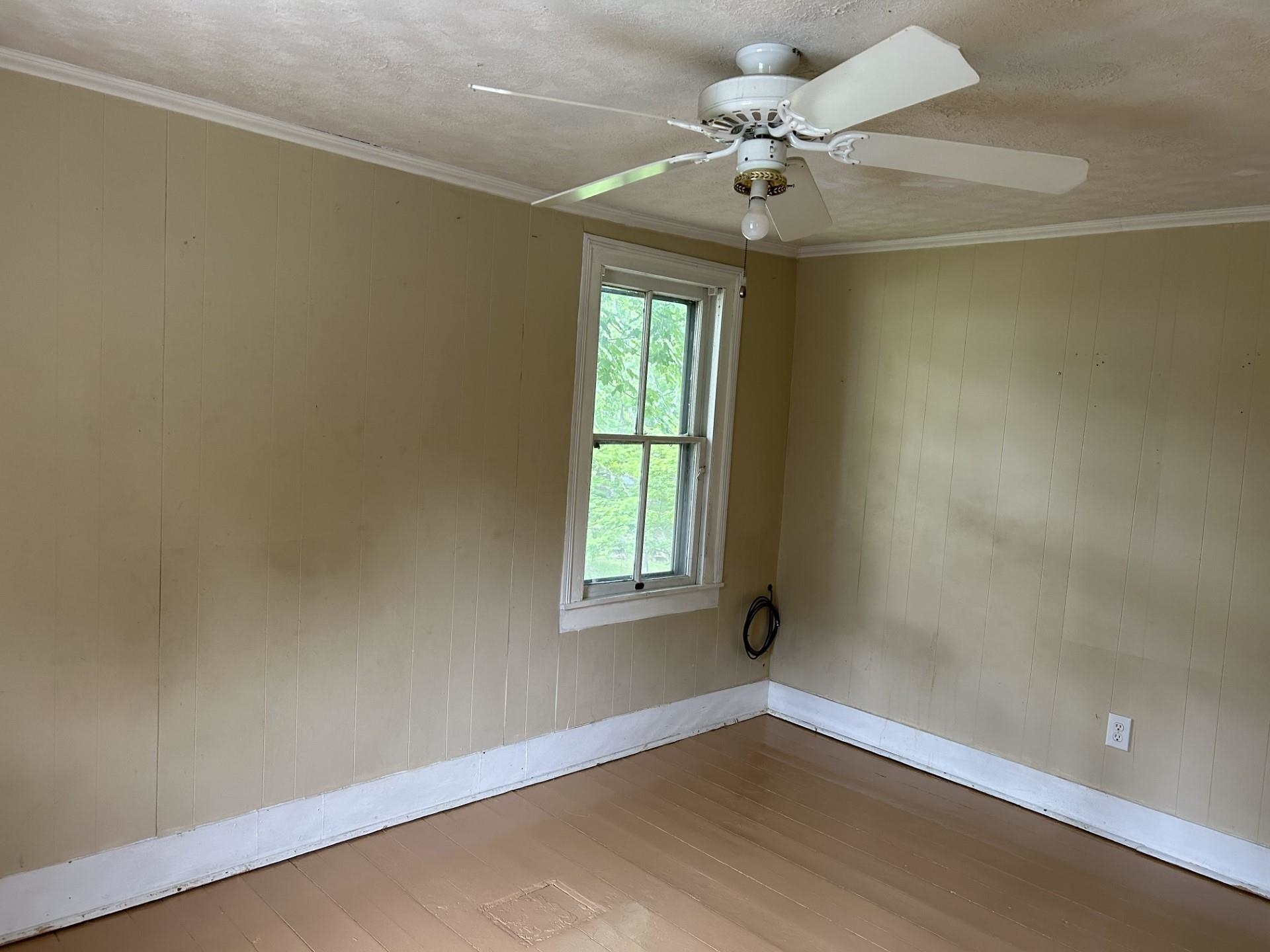 29 Tye River Turnpike Raphine, VA 24472 - Photo 16 of 17 an empty room with a window and a fan