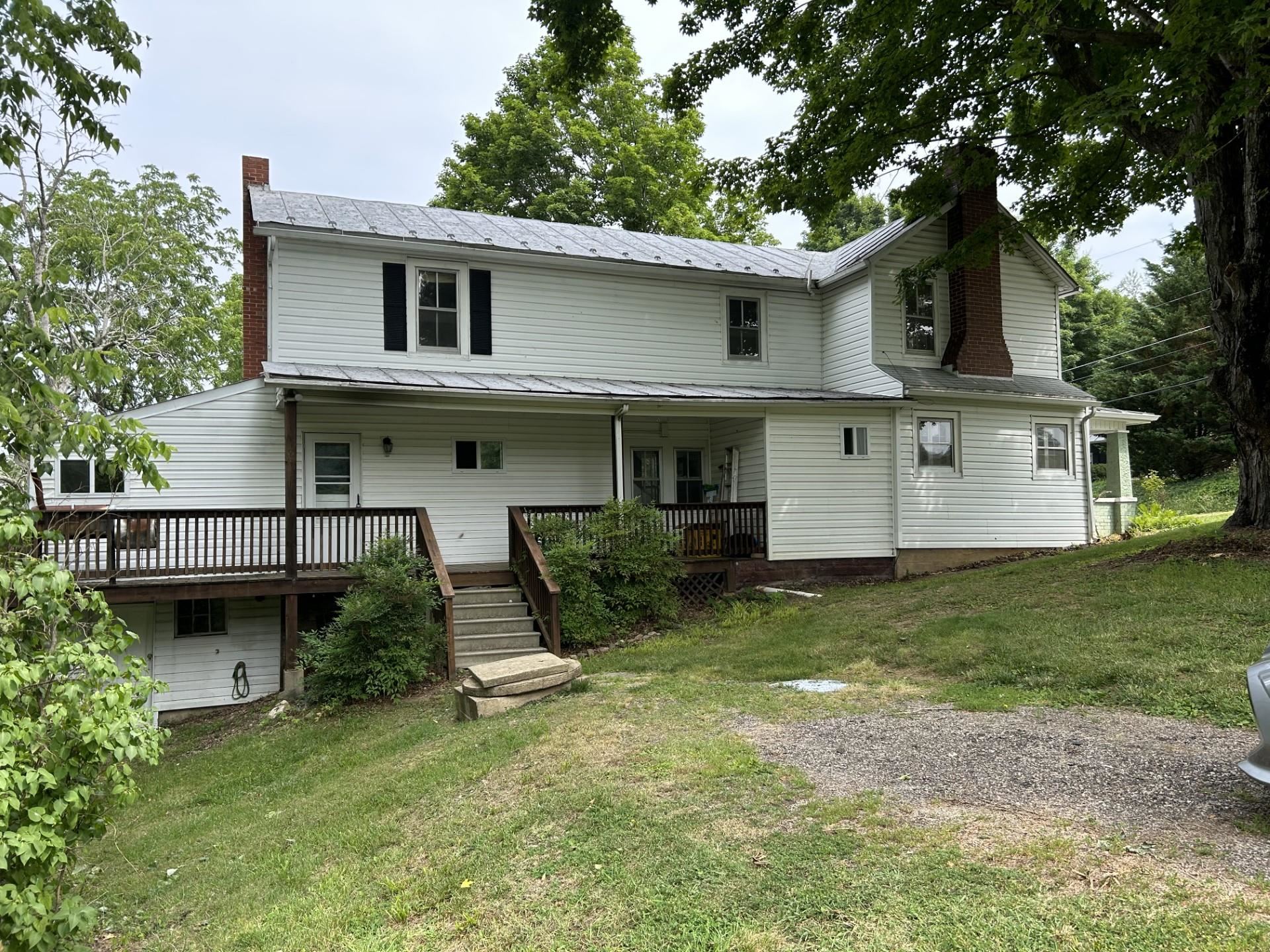 29 Tye River Turnpike Raphine, VA 24472 - Photo 2 of 17 a front view of a house with garden