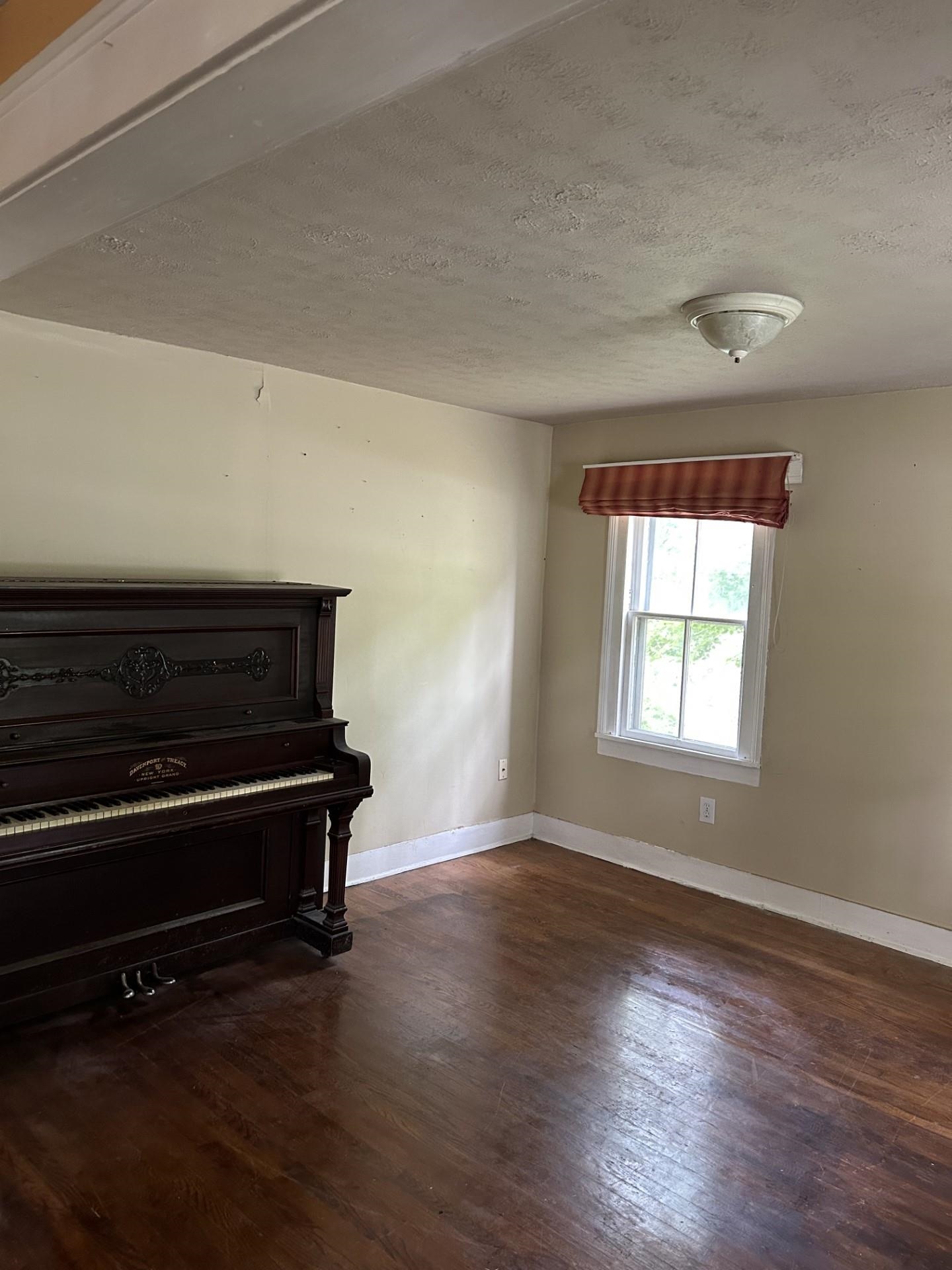 29 Tye River Turnpike Raphine, VA 24472 - Photo 6 of 17 a living room with wooden floor and a window