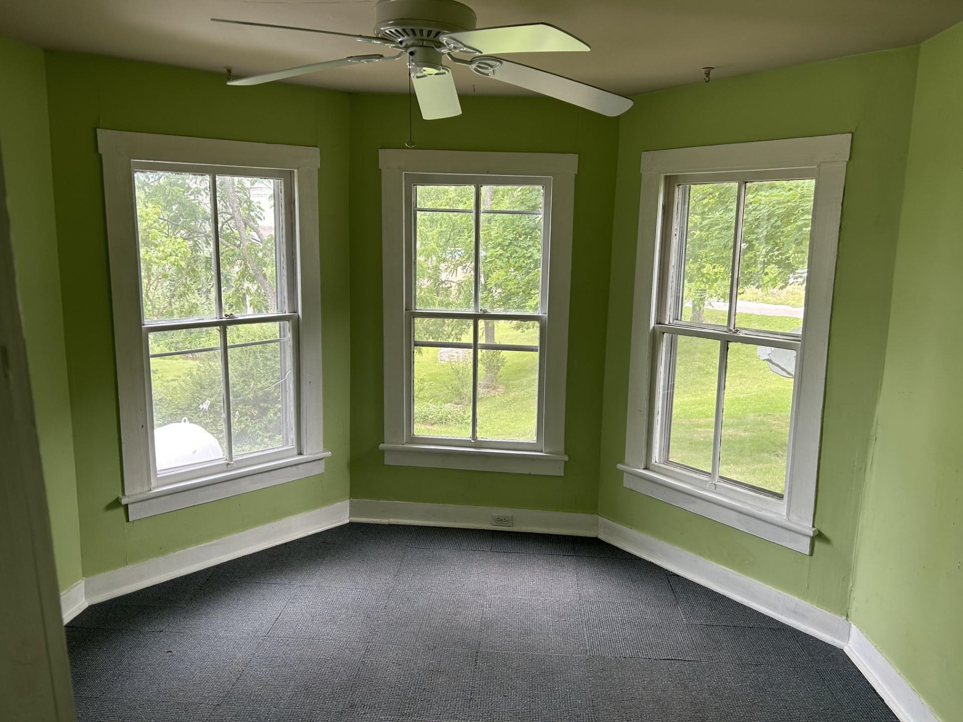 29 Tye River Turnpike Raphine, VA 24472 - Photo 7 of 17 a view of an empty room with window and chandelier fan