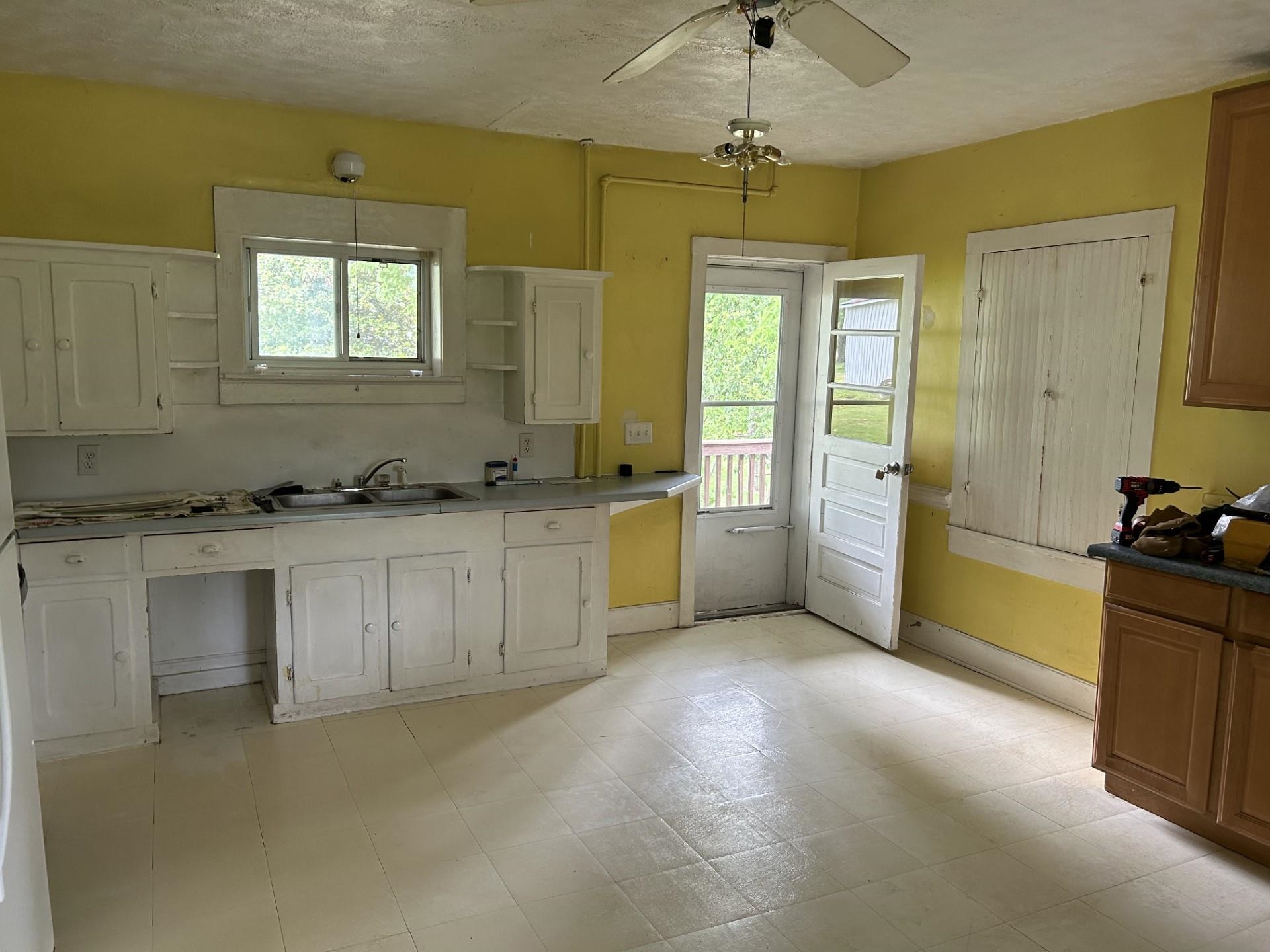 29 Tye River Turnpike Raphine, VA 24472 - Photo 8 of 17 a view of a kitchen with dishwasher and white cabinets