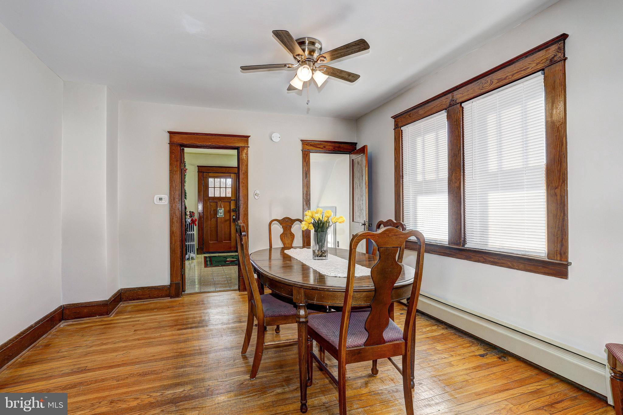 7416 Old Harford Road Baltimore, MD 21234 - Photo 13 of 35 Dining room with ceiling fan and wood floors
