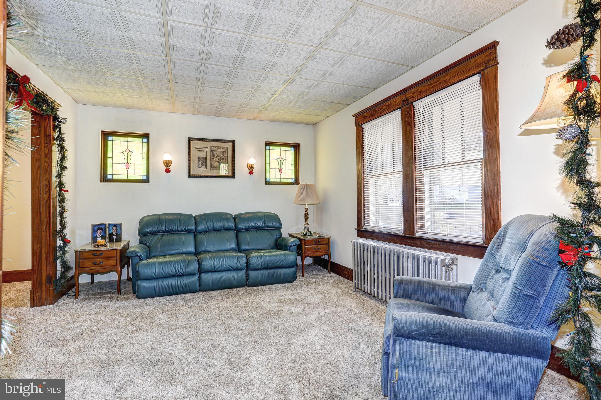7416 Old Harford Road Baltimore, MD 21234 - Photo 7 of 35 Living Room w/two sconces and stain glass windows