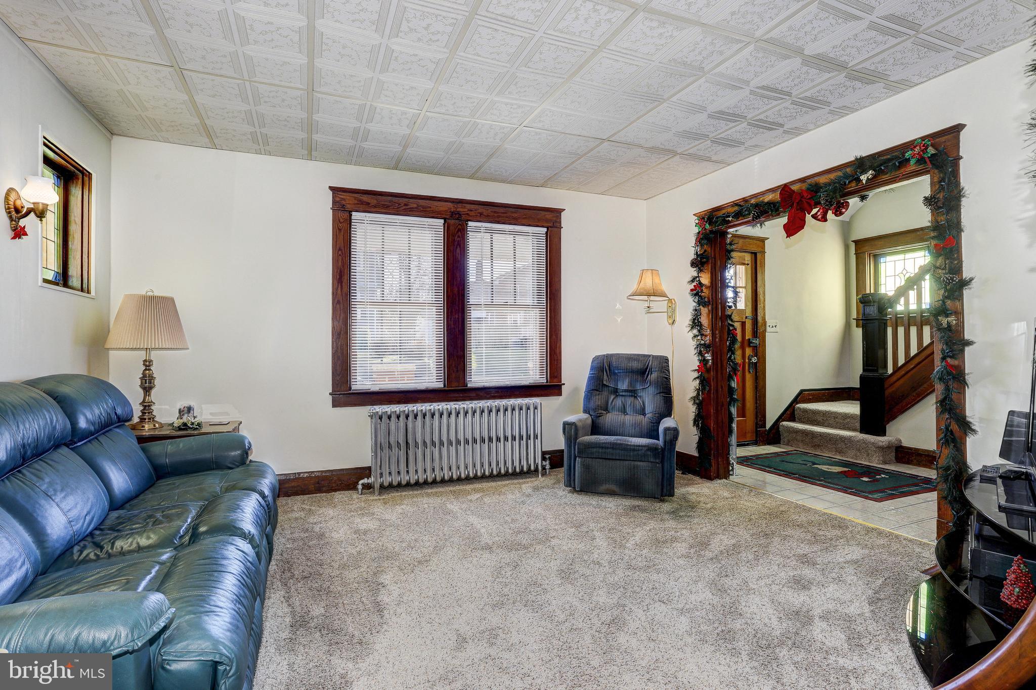 7416 Old Harford Road Baltimore, MD 21234 - Photo 8 of 35 Living room leading to foyer