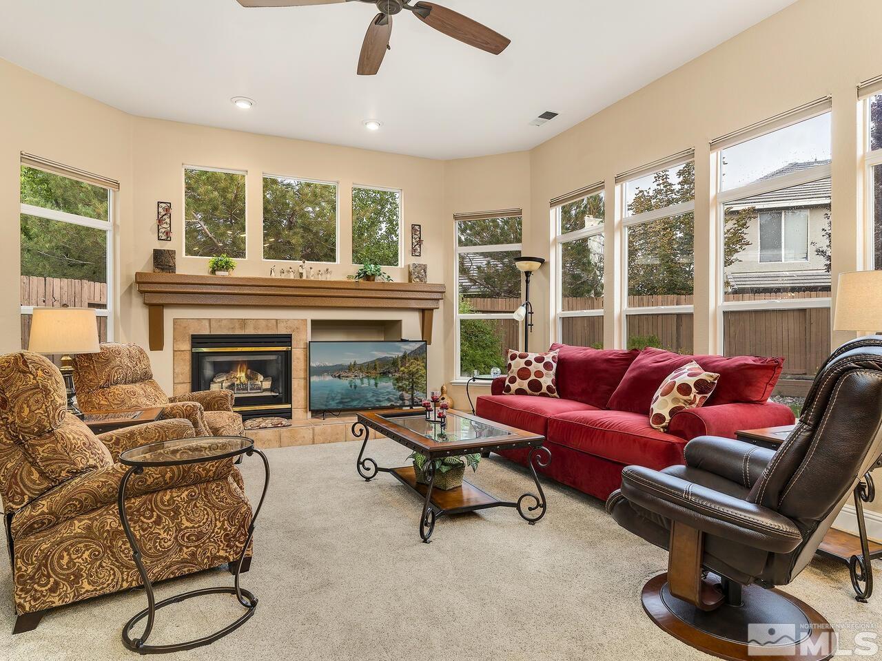 9684 Rolling Rock Way Reno, NV 89521 - Photo 16 of 34 a living room with furniture and a fireplace