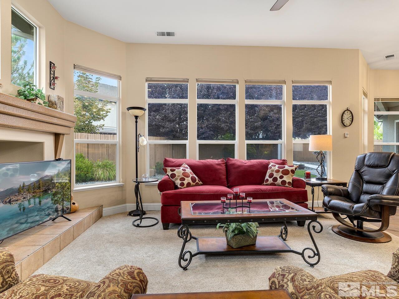 9684 Rolling Rock Way Reno, NV 89521 - Photo 17 of 34 a living room with furniture and a potted plant