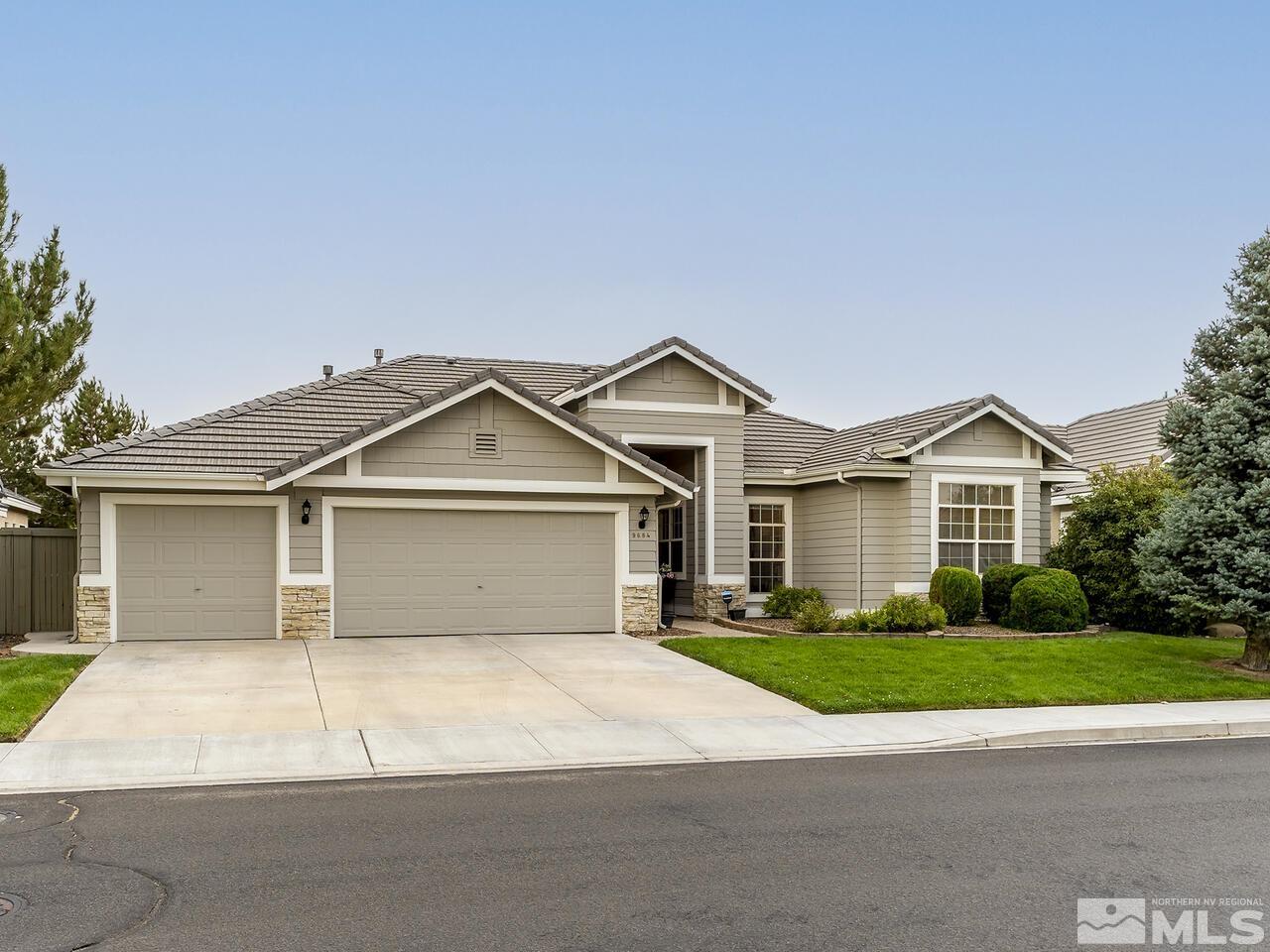 9684 Rolling Rock Way Reno, NV 89521 - Photo 2 of 34 a view of a house with a yard and large tree
