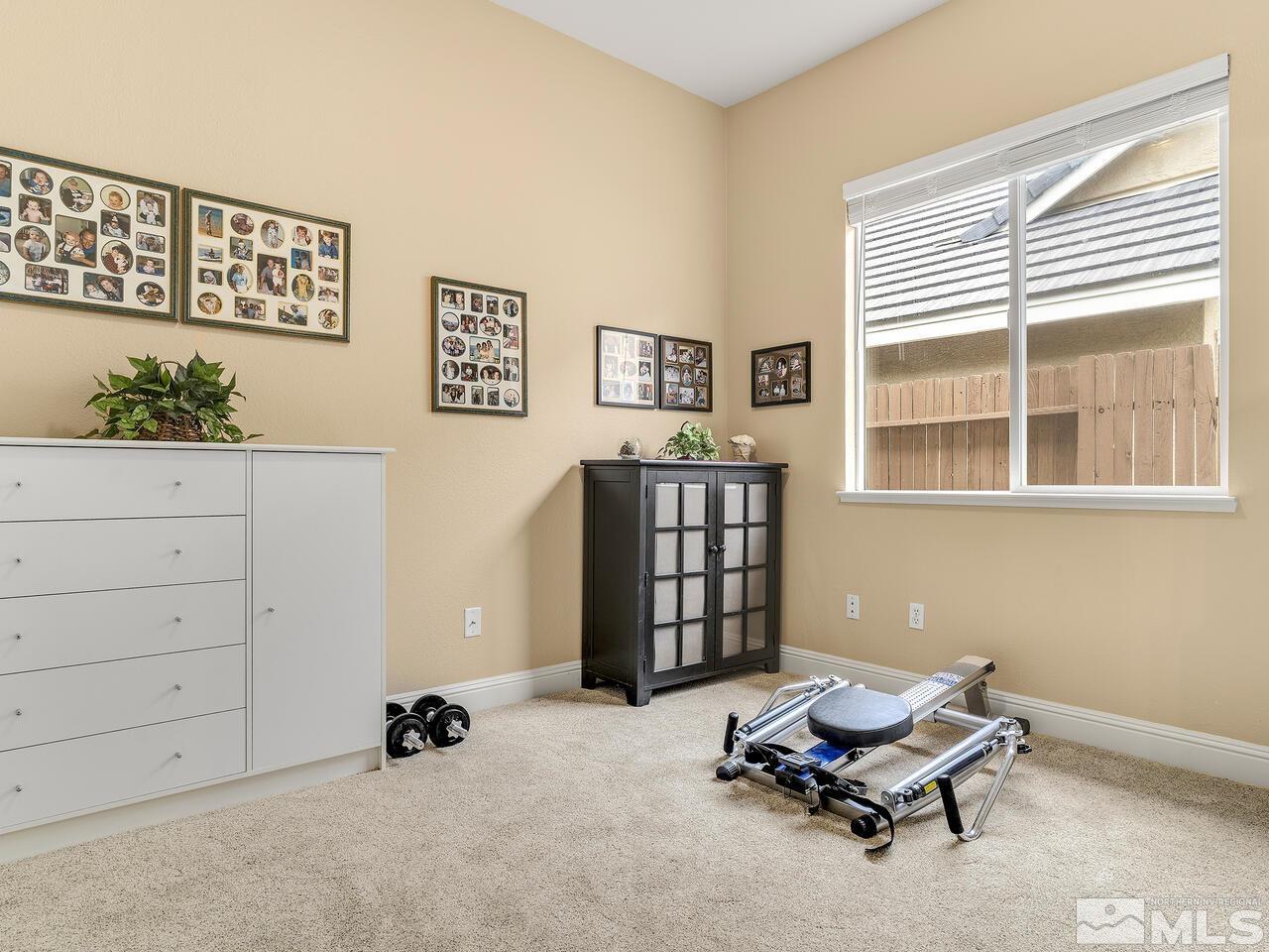 9684 Rolling Rock Way Reno, NV 89521 - Photo 23 of 34 a living room with furniture and a window