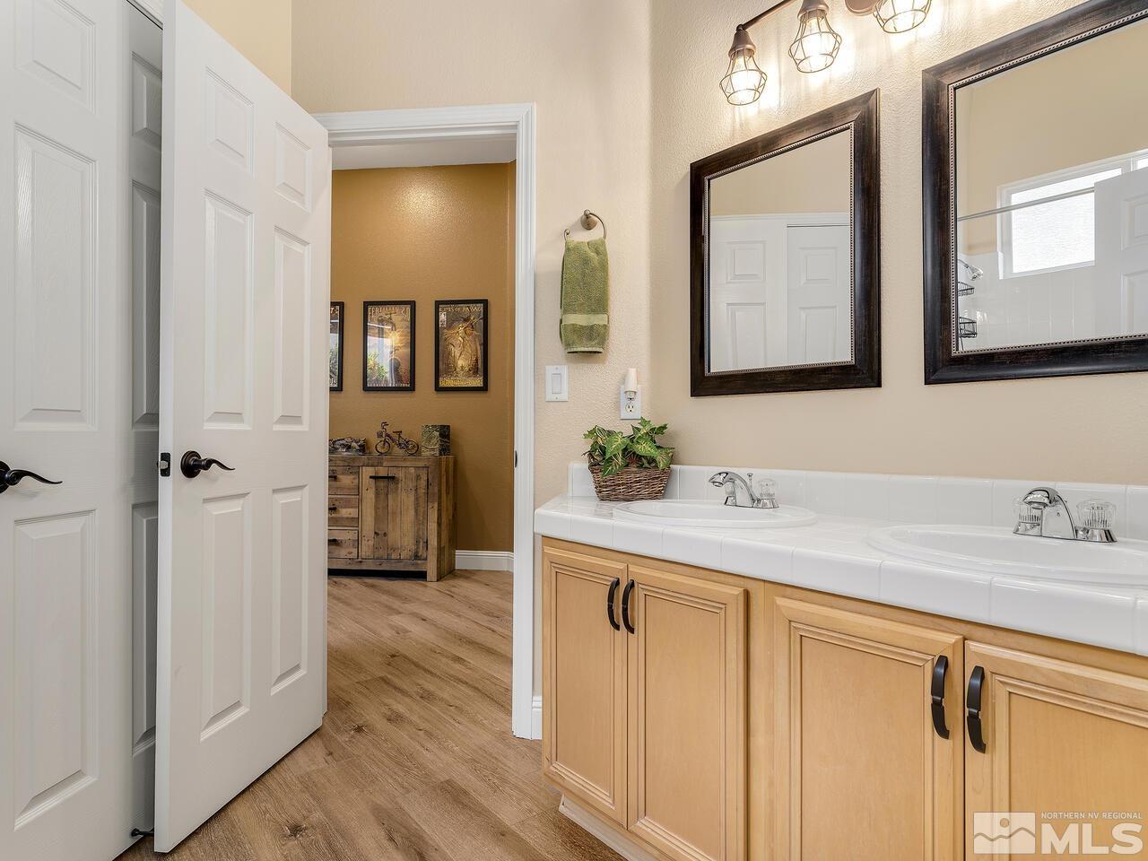 9684 Rolling Rock Way Reno, NV 89521 - Photo 25 of 34 a bathroom with a sink and a mirror