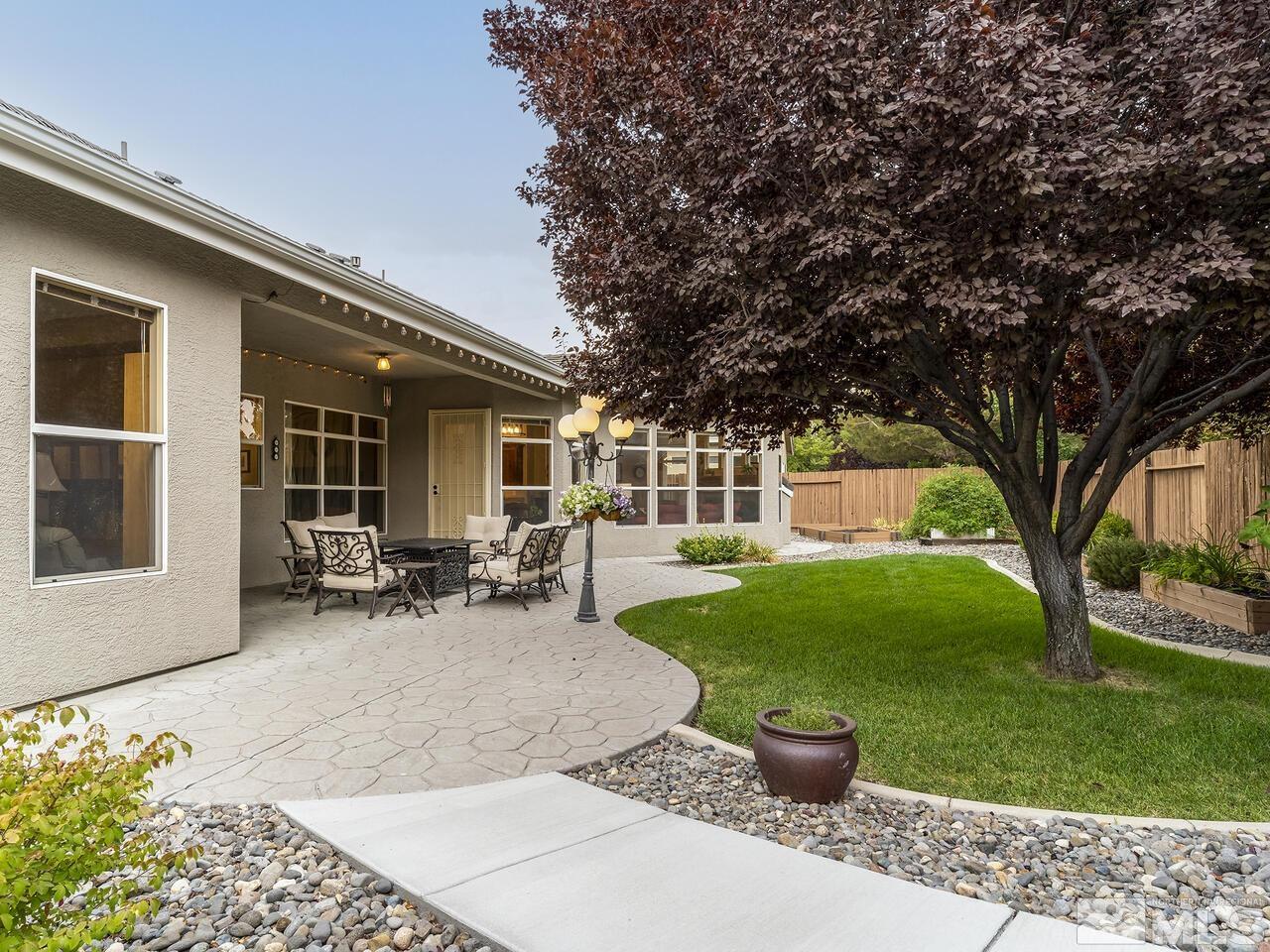 9684 Rolling Rock Way Reno, NV 89521 - Photo 30 of 34 a view of a backyard with sitting area and garden
