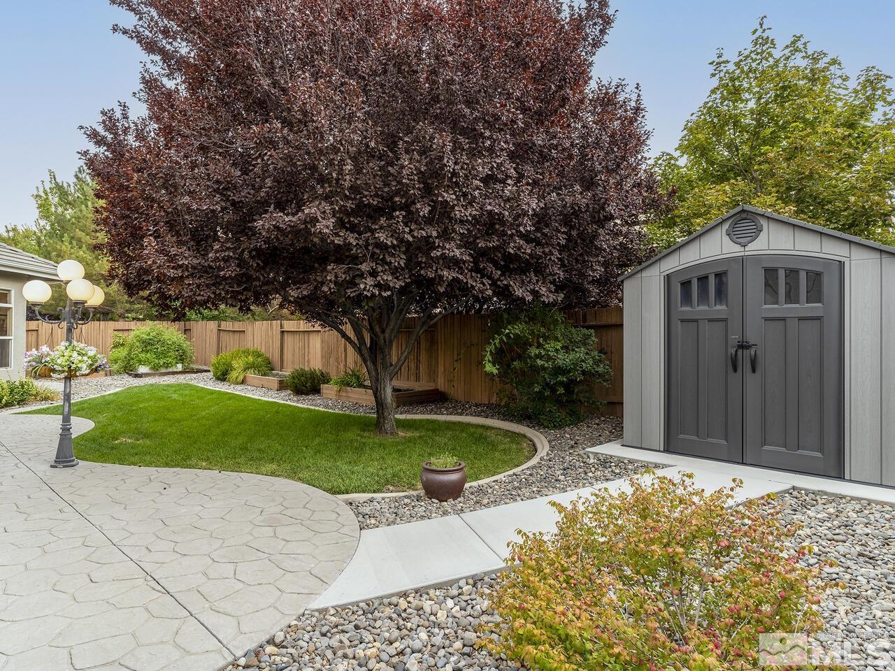 9684 Rolling Rock Way Reno, NV 89521 - Photo 34 of 34 a front view of a house with a garden