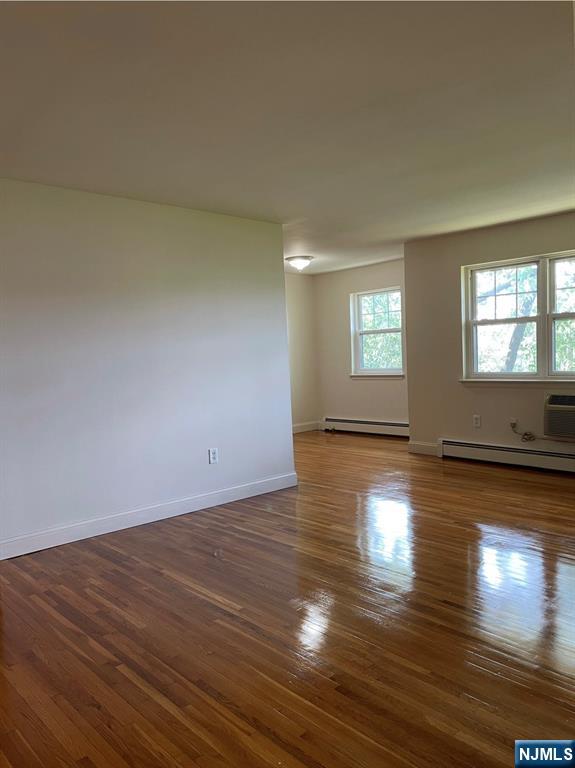 220 Meadow Lane, Unit D37 Secaucus, NJ 07094 - Photo 5 of 6 a view of empty room with wooden floor and fan