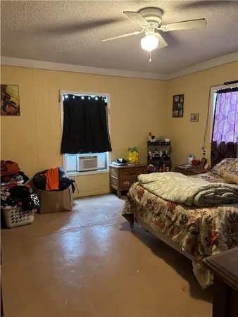 a bedroom with bed and window