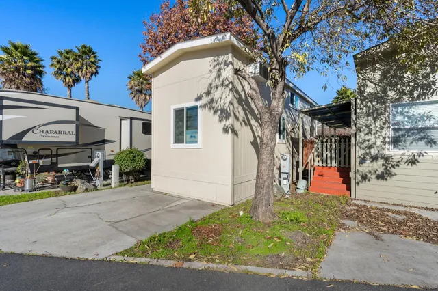 a front view of a building with garden