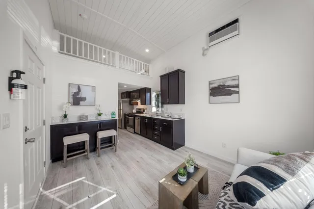 a living room with furniture and flat screen tv